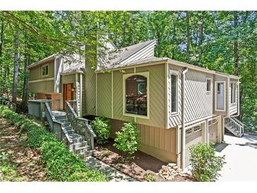 Stunning home with meticulous landscaping and a welcoming entrance at 970 Pine Grove Pointe Dr, Roswell, GA 30075