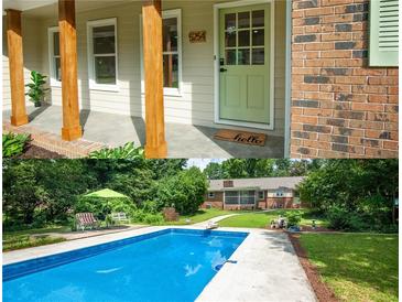 Inviting front porch with rustic wood columns and charming green door at 5254 Corinth Dr, Stone Mountain, GA 30087