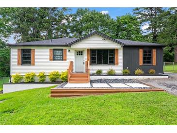 Charming single-story home with a well-manicured lawn, and freshly painted exterior at 1326 Stella Sw Cir, Mableton, GA 30126