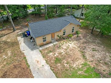 Charming single-story brick home featuring a new roof and front yard at 6010 Fieldcrest Dr, Morrow, GA 30260