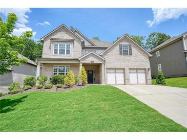 Beautiful two-story brick home featuring manicured landscaping and a two car garage at 622 Denali Dr, Mableton, GA 30126