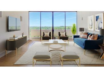 Bright living room with floor-to-ceiling windows and contemporary furnishings at 2575 Peachtree Ne Rd # 15G, Atlanta, GA 30305