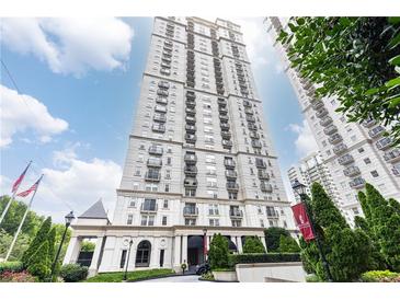Luxury high-rise building featuring an elegant facade, manicured landscaping, and a welcoming entrance at 199 14Th Ne St # 412, Atlanta, GA 30309