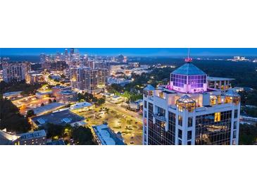 Stunning twilight view showcases building in a thriving city, boasting great location and easy access to amenities at 2828 Peachtree Nw Rd # P 3300, Atlanta, GA 30305