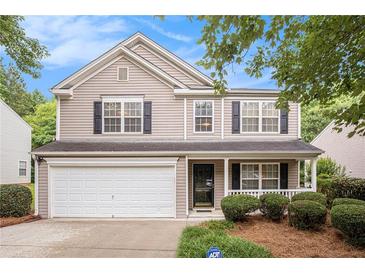 Charming two-story home featuring a well-maintained front yard and attached garage at 6738 Brookfield Way, Douglasville, GA 30134