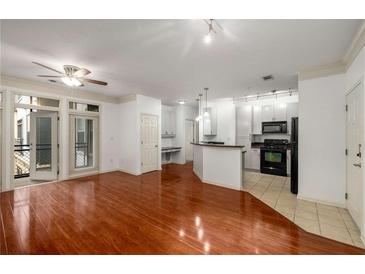Spacious open concept living area with hardwood floors and updated kitchen at 400 17Th Nw St # 2308, Atlanta, GA 30363