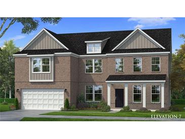 Charming two-story brick home features a traditional design with a two-car garage and well-maintained landscaping at 2516 Cadenza Cir, Dacula, GA 30019