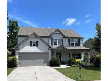 Charming two-story home boasts a well-manicured lawn and inviting curb appeal, perfect for Gathering living at 110 Serendipity Way, Dallas, GA 30157