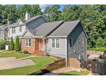 Charming two story home with a combination of brick and vinyl siding, featuring a well maintained front lawn at 1139 Shiloh Nw Ln, Kennesaw, GA 30144