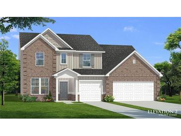 Inviting two-story brick home with a front-load garage and well-manicured lawn at 316 Moab Ct, Stockbridge, GA 30281