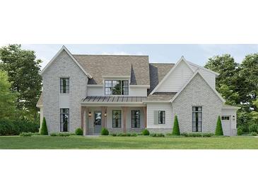 Charming two-story home with gray brick and siding, a covered porch, and a well-manicured lawn at 133 Daxton Dr, Canton, GA 30115