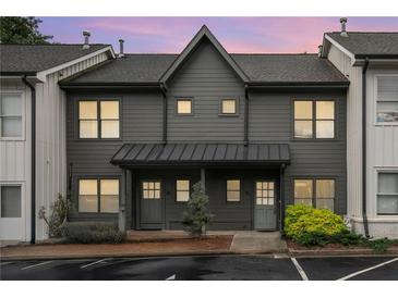 Charming townhome showcasing a newly painted exterior and well-maintained landscaping at 1516 Howell Mill Nw Rd # 16, Atlanta, GA 30318