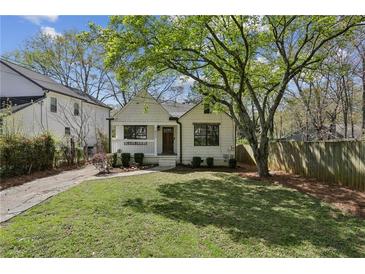 Charming home with a well-maintained lawn, mature trees, and inviting curb appeal at 1833 Flat Shoals Se Rd, Atlanta, GA 30316