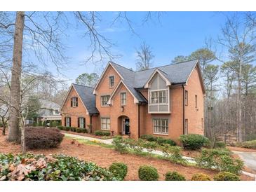 Charming brick home with manicured landscaping and a welcoming entrance in a peaceful setting at 5936 Millstone Ln, Stone Mountain, GA 30087