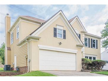 Lovely two-story home with a pristine white garage door and well-manicured front yard at 2794 Craig Ct, Marietta, GA 30062