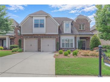 Charming two-story home featuring a brick facade, attached two car garage and manicured lawn at 6054 Brookhaven Cir, Duluth, GA 30097