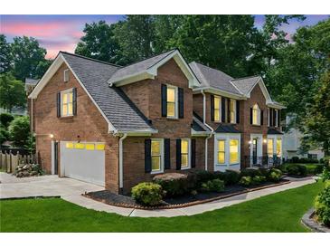 Elegant brick home with a two-car garage and well-manicured landscaping at 742 Maggie Nw Ct, Kennesaw, GA 30144