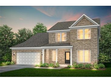 Inviting two-story brick home featuring an attached two-car garage and a well-manicured front lawn at 3095 Newell Dr Dr, Dacula, GA 30019