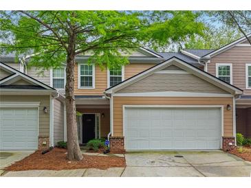 Charming townhome with a two-car garage and well-maintained landscaping at 3300 Suttles Sw Dr, Atlanta, GA 30331