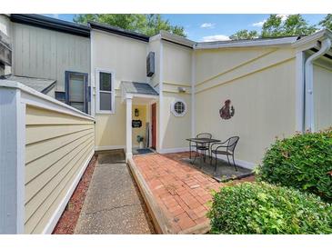Inviting entrance with a brick patio and seating area, featuring a charming exterior at 764 Patterns Sw Dr, Mableton, GA 30126