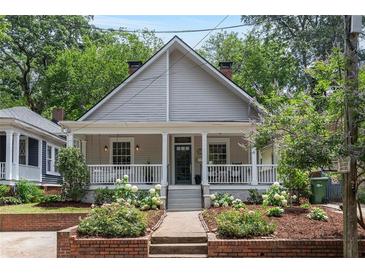 Charming single-Gathering home with a covered front porch and nicely landscaped front yard at 343 Josephine Ne St, Atlanta, GA 30307