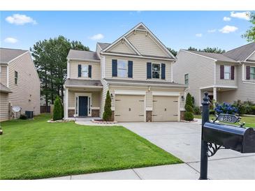 Charming two-story home with a well-manicured lawn and a two-car garage at 133 Worthing Ln, Fairburn, GA 30213