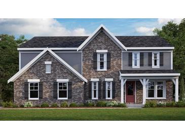 Charming two-story home showcasing a brick facade, gray siding, complemented by a well-manicured lawn and detailed trim at 250 Willow Bend Rd, Hiram, GA 30141