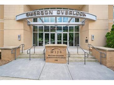 Emerson Overlook building entrance with brick signage, accessible ramp and metal and glass doors at 326 Roswell Se St # 406, Marietta, GA 30060