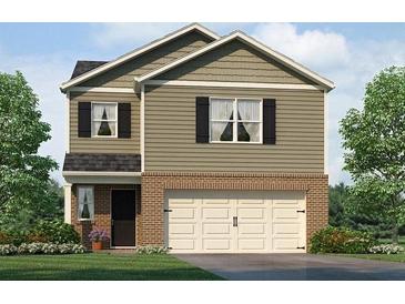 Two-story home with neutral siding, brick accents, attached garage, and well-manicured landscaping at 504 Oak View Ln, Dallas, GA 30157
