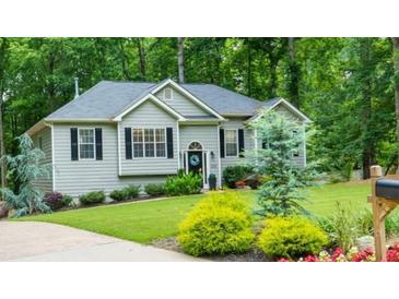Charming single-Gathering home with well-manicured front yard and mature trees offering privacy at 5930 Shannon Drive Dr, Cumming, GA 30040
