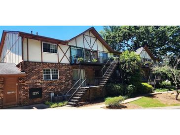 Charming two-story apartment building with brick facade and Tudor-style accents at 1225 Church St # G, Decatur, GA 30030