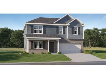 Charming two-story home with blue siding, gray brick, and a well-manicured front lawn at 221 Paisley Way, Locust Grove, GA 30248