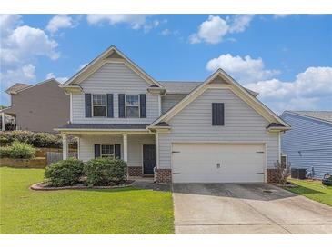 Charming two-story home with a manicured front yard and attached two-car garage, creating a welcoming curb appeal at 27 Autumn Canyon Se Path, Cartersville, GA 30121
