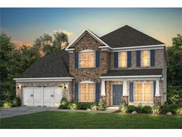 Beautiful two-story home featuring a stone and brick facade, dark roof, blue shutters, and a two car garage at 4317 Azalea Ridge Way, Hoschton, GA 30548