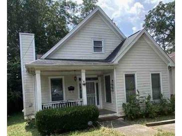 Charming home featuring a cozy front porch, well-kept front yard, and timeless architectural details at 1378 Lucile Sw Ave, Atlanta, GA 30310