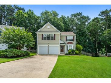 Charming two-story home with a well-manicured lawn and a two-car garage at 496 Bottesford Nw Dr, Kennesaw, GA 30144