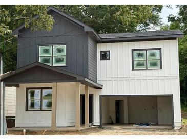 Modern two-story home with a contrasting gray and white exterior and an attached two-car garage at 511 Casanova Se St, Atlanta, GA 30315