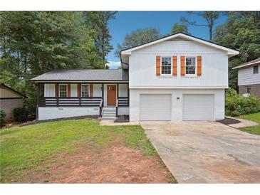 Charming two-story home featuring a two-car garage and inviting front porch at 4148 Emerald North Dr, Decatur, GA 30035