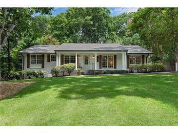 Charming one-story home with a lush front lawn and inviting curb appeal at 4309 King Valley Se Dr, Smyrna, GA 30082
