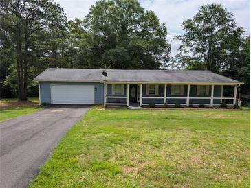 Charming single-story home with a covered front porch and attached garage at 446 Westbrook Rd, Carrollton, GA 30116