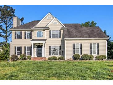 Charming two-story home with manicured lawn, classic curb appeal, and inviting front entrance at 2275 Holly Run Dr, Jonesboro, GA 30236