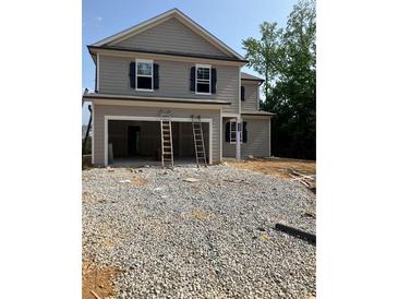 New two-story home featuring a two-car garage and classic curb appeal at 7226 Lacey Dr Lot 125 Dr, Douglasville, GA 30134