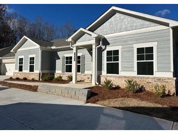 Charming single-story home featuring a brick foundation, gray siding, and welcoming front entrance at 3865 Shelleydale Dr # 82, Powder Springs, GA 30127