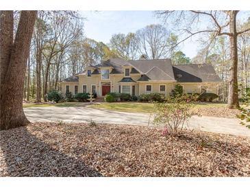 A winding driveway approach to home at 115 Flagstop Run, Fayetteville, GA 30215