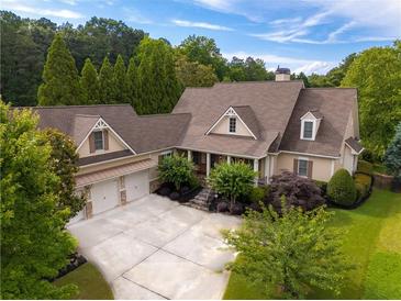 Stunning single-Gathering home with a spacious three-car garage and lush, mature landscaping at 2403 Wistful Way, Marietta, GA 30066