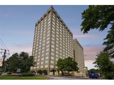 Striking exterior shot of building featuring a high-rise structure and manicured greenery at 2479 Peachtree Ne Rd # 301, Atlanta, GA 30305