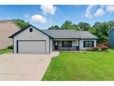 Charming single-story home with a well-manicured lawn and inviting curb appeal at 314 Spring Falls Drive, Lawrenceville, GA 30045