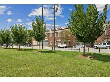 Charming brick building featuring green landscaping and visible signage for Crown Candy Lofts at 320 Martin Luther King Jr Se Dr # 9, Atlanta, GA 30312