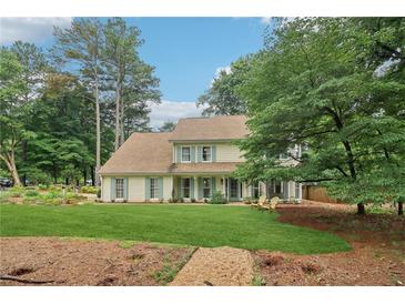 Charming two-story home featuring a well-manicured lawn and inviting curb appeal at 2965 Village Dr, Marietta, GA 30062