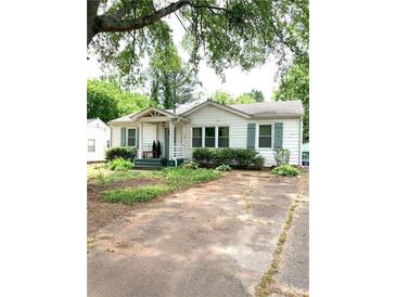 Charming single story home with white siding, a cozy front porch, and inviting curb appeal at 3604 Orchard Cir, Decatur, GA 30032